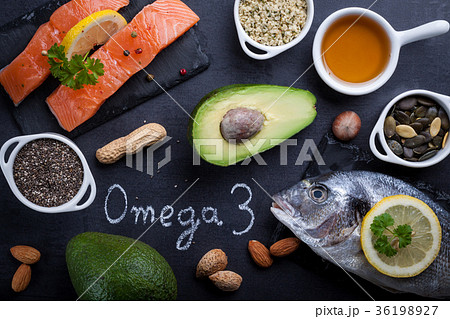 Black slate table with product rich in omega 3. 36198927