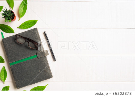 Flat lay book glasses and pen  36202878