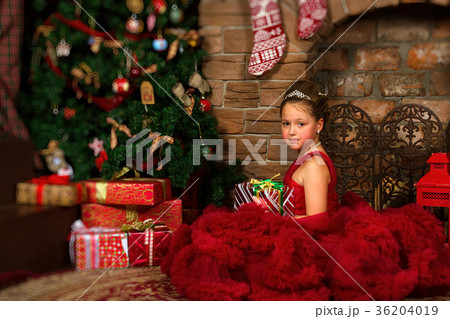 Little winter Princess, girl with Christmas gift 36204019