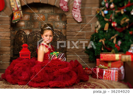 Little winter Princess, girl with Christmas gift 36204020