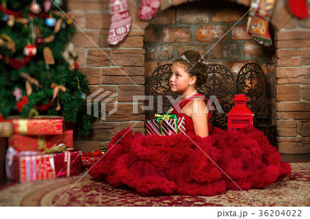 Little winter Princess, girl with Christmas gift 36204022