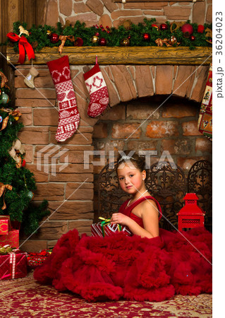 Little winter Princess, girl with Christmas gift 36204023