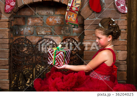 Little winter Princess, girl with Christmas gift 36204025