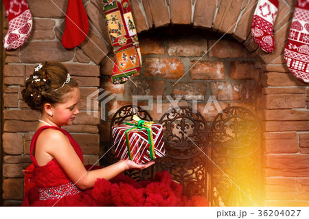 Little winter Princess, girl with Christmas gift 36204027