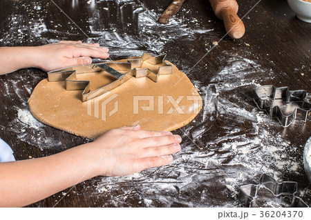 Cutting dough on different shapes. gingerbread Cutting dough on different shapes. gingerbread 36204370