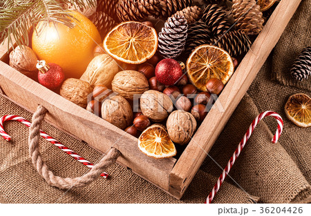 Box with Christmas decoration, cones and ornaments Box with Christmas decoration, cones and ornaments 36204426
