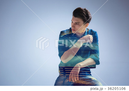 Pensive young man dreaming against nature 36205106