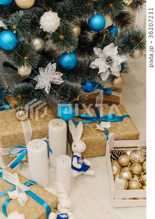 Brown present boxes decorated with ribbons stand 36207231