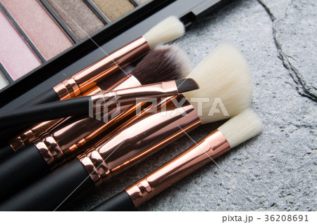 various makeup products on dark background 36208691