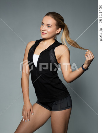 young woman in black sportswear posing young woman in black sportswear posing 36211456