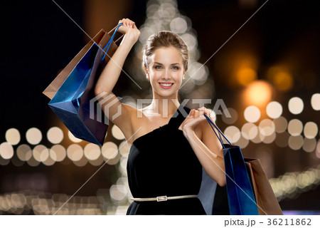 woman in black with shopping bags at christmas 36211862