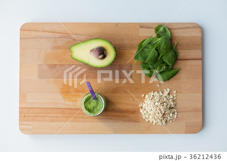 jar with puree or baby food on wooden board jar with puree or baby food on wooden board 36212436