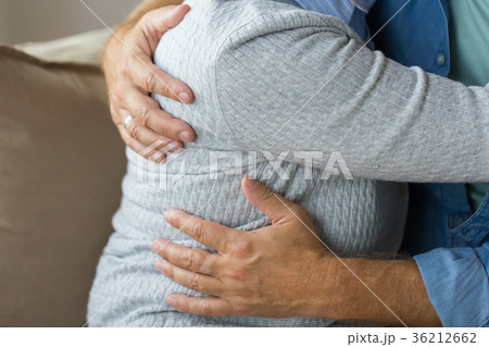 close up of married senior couple hugging 36212662