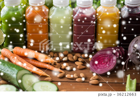 bottles with different fruit or vegetable juices 36212663