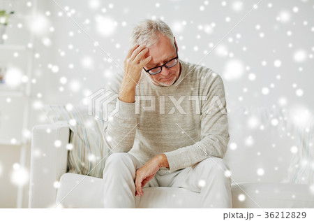 senior man suffering from headache at home 36212829