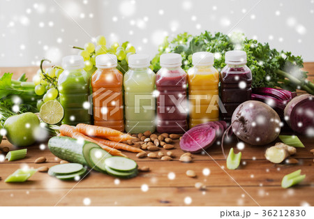 bottles with different fruit or vegetable juices 36212830