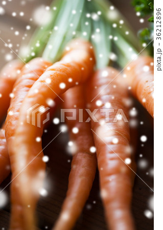 close up of carrot bunch on wooden table 36212896