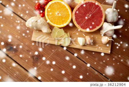 citrus, ginger, garlic and rowanberry on wood 36212904