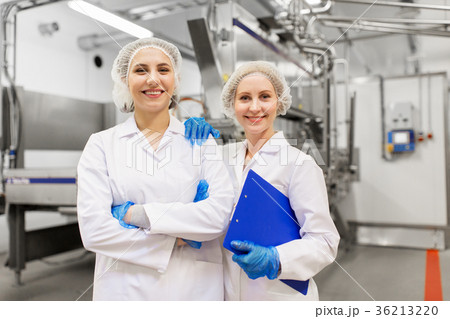 happy women technologists at ice cream factory 36213220
