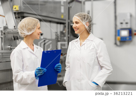 happy women technologists at ice cream factory 36213221