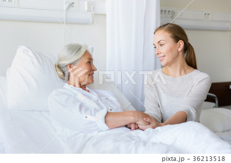 daughter visiting senior mother at hospital 36213518