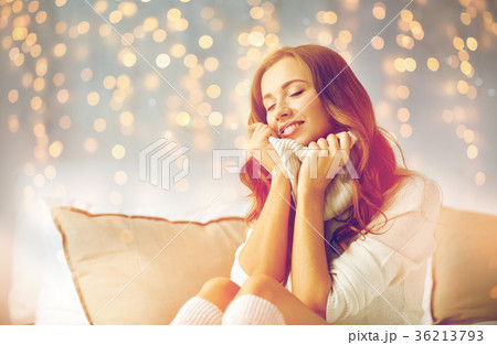 happy young woman in warm pullover at home happy young woman in warm pullover at home 36213793