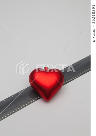 The red heart and the unrolled exposed 35mm film The red heart and the unrolled exposed 35mm film 36218291
