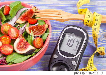 Fruit and vegetable salad and glucose meter 36219304