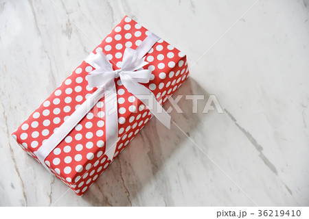 Top view of red with white dot gift box. 36219410