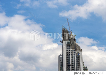 Crane working on high building 36224202