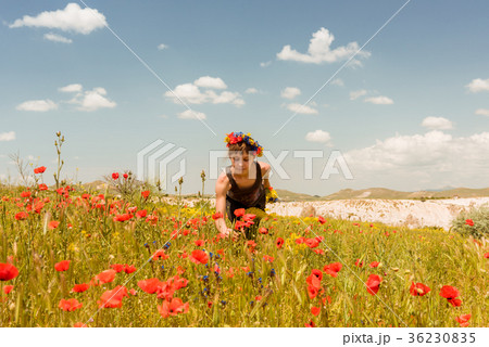Teen girl in poppy field outdoor Teen girl in poppy field outdoor 36230835