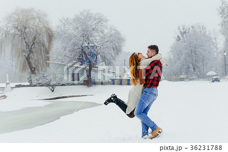 Happy loving couple is having fun in the winter Happy loving couple is having fun in the winter 36231788