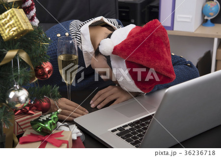Women sleeping on her desk after celebrating. Women sleeping on her desk after celebrating. 36236718