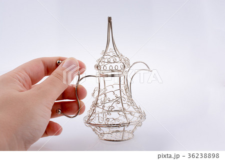 Silver color metal jug in hand Silver color metal jug in hand 36238898