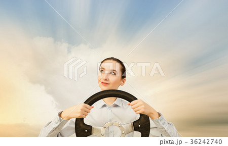 Woman with steering wheel Woman with steering wheel 36242740
