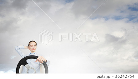 Woman with steering wheel Woman with steering wheel 36242754