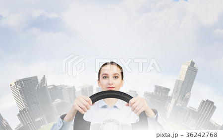 Woman with steering wheel Woman with steering wheel 36242768