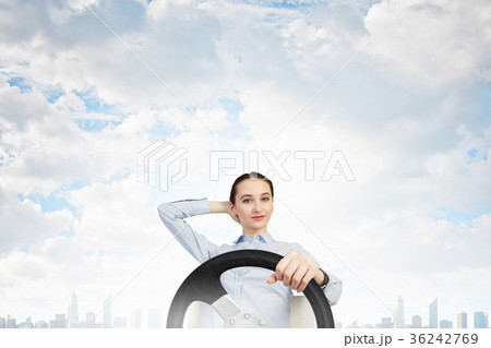 Woman with steering wheel Woman with steering wheel 36242769