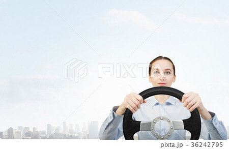 Woman with steering wheel Woman with steering wheel 36242795