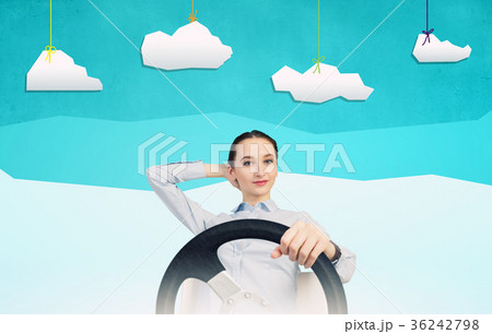 Woman with steering wheel Woman with steering wheel 36242798