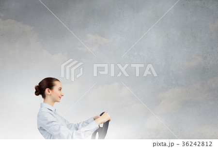 Woman with steering wheel 36242812