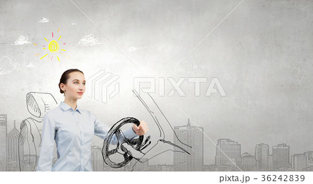 Woman with steering wheel Woman with steering wheel 36242839