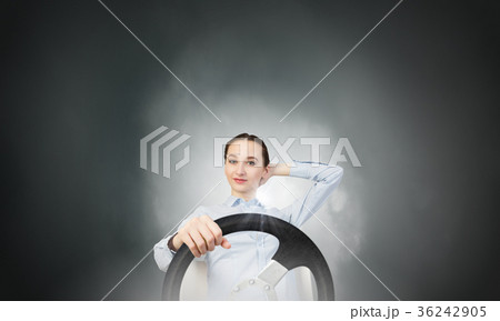 Woman with steering wheel Woman with steering wheel 36242905