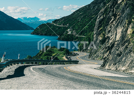 Winding Road along Mountain Cliff and Lake Winding Road along Mountain Cliff and Lake 36244815