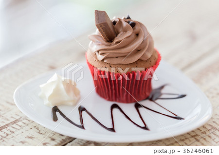 Cupcakes, muffins cake with cream on wooden table. Cupcakes, muffins cake with cream on wooden table. 36246061