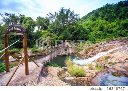 Wooden Bridge with Railings over River at Stones 36246767