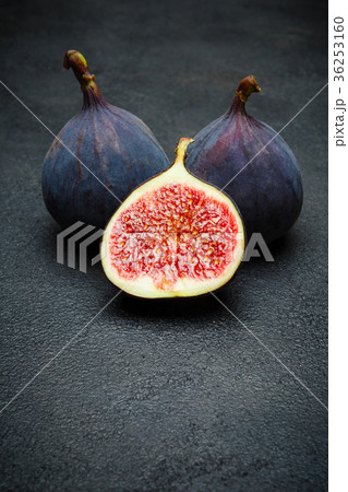 Fig isolated on dark concrete background Fig isolated on dark concrete background 36253160