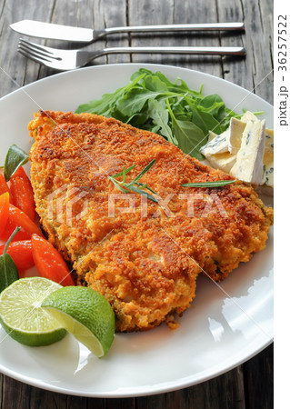 white fish steak with salad and cheese 36257522