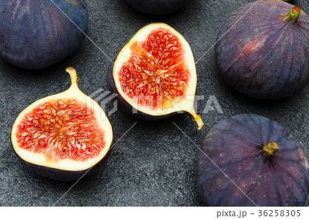 Fig isolated on dark concrete background Fig isolated on dark concrete background 36258305