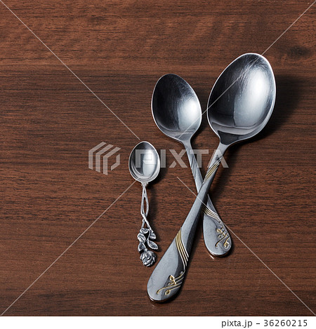 three spoons on a wooden background 36260215